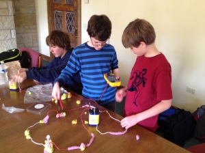 teen boys playing with squishy circuits